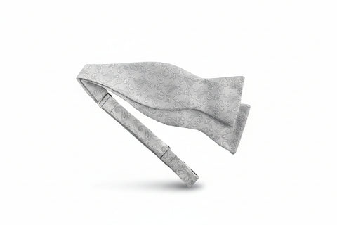 Gray paisley bow tie and pocket square set on a white background